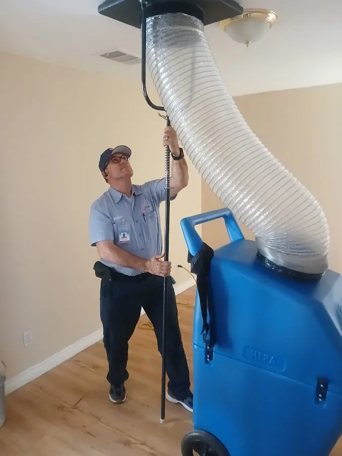 Furnace Tune-Up technician using HEPA equipment in Montevallo